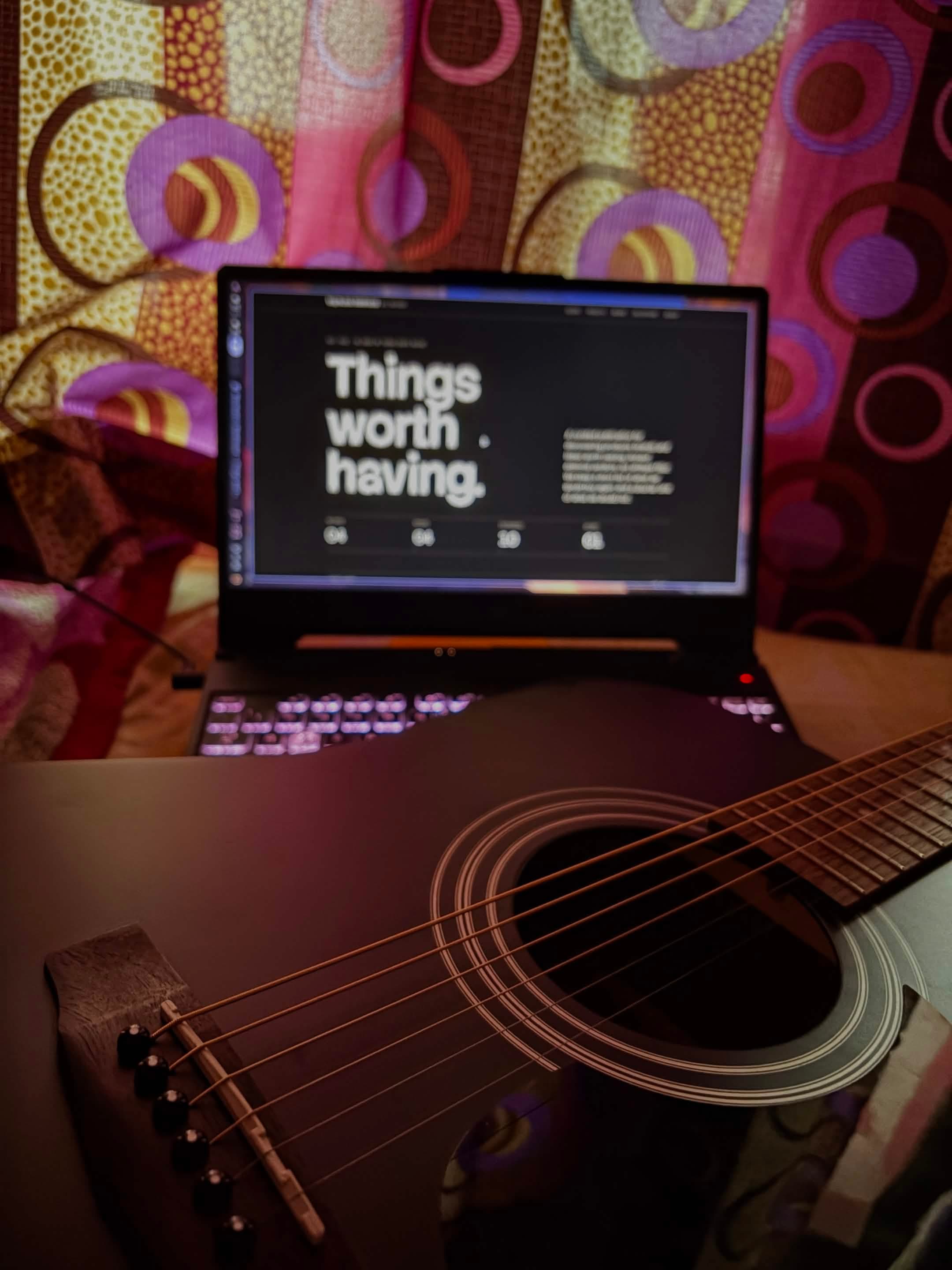 A dreadnought acoustic guitar on the bed :(